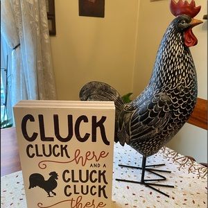 Rooster and sign
